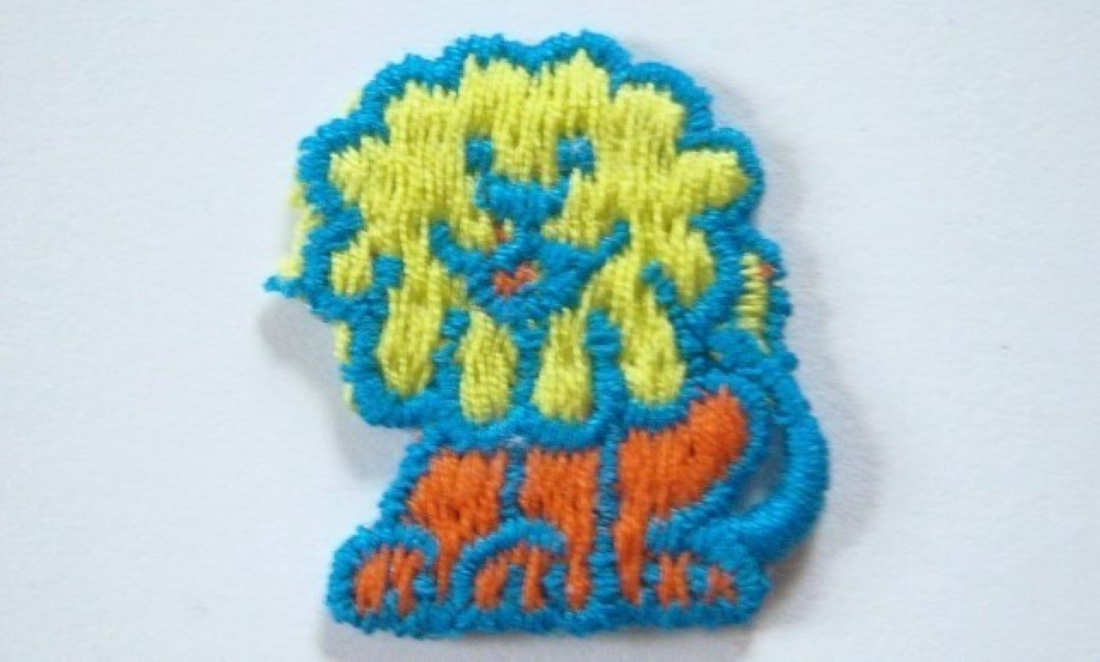 Turquoise/Orange Lion Applique